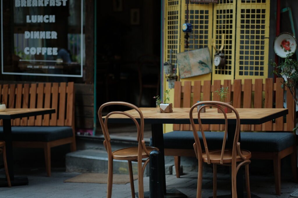 Empty cafe on the street. Terrace with chairs and tables for gue